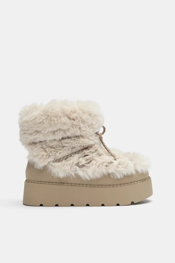 Bottes plates en fausse fourrure Bottes plates en fausse fourrure