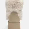 Bottes plates en fausse fourrure Bottes plates en fausse fourrure