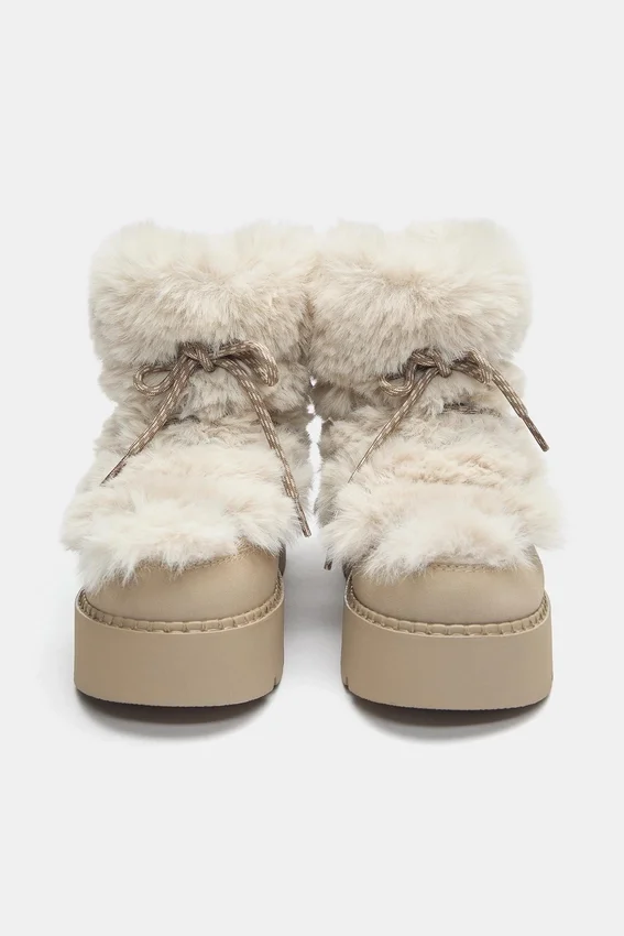 Bottes plates en fausse fourrure Bottes plates en fausse fourrure