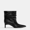 Bottes à talons hauts froncées Bottes à talons hauts froncées