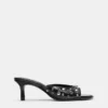 Mules à talons avec clous Mules à talons avec clous