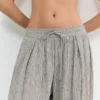 Pantalon à entrejambe tombant à carreaux Pantalon à entrejambe tombant à carreaux