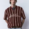 Polos en maille rayée avec fermeture à glissière Polos en maille rayée avec fermeture à glissière