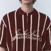 Polos en maille rayée avec fermeture à glissière Polos en maille rayée avec fermeture à glissière
