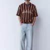 Polos en maille rayée avec fermeture à glissière Polos en maille rayée avec fermeture à glissière