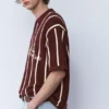 Polos en maille rayée avec fermeture à glissière Polos en maille rayée avec fermeture à glissière