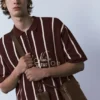 Polos en maille rayée avec fermeture à glissière Polos en maille rayée avec fermeture à glissière