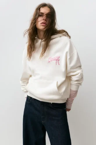 Sweat à capuche avec motif en forme de nœud