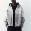 Sweat à capuche zippé en interlock