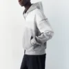 Sweat à capuche zippé en interlock