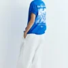 T-shirts bleus avec motifs et slogans T-shirts bleus avec motifs et slogans