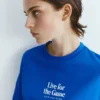 T-shirts bleus avec motifs et slogans T-shirts bleus avec motifs et slogans